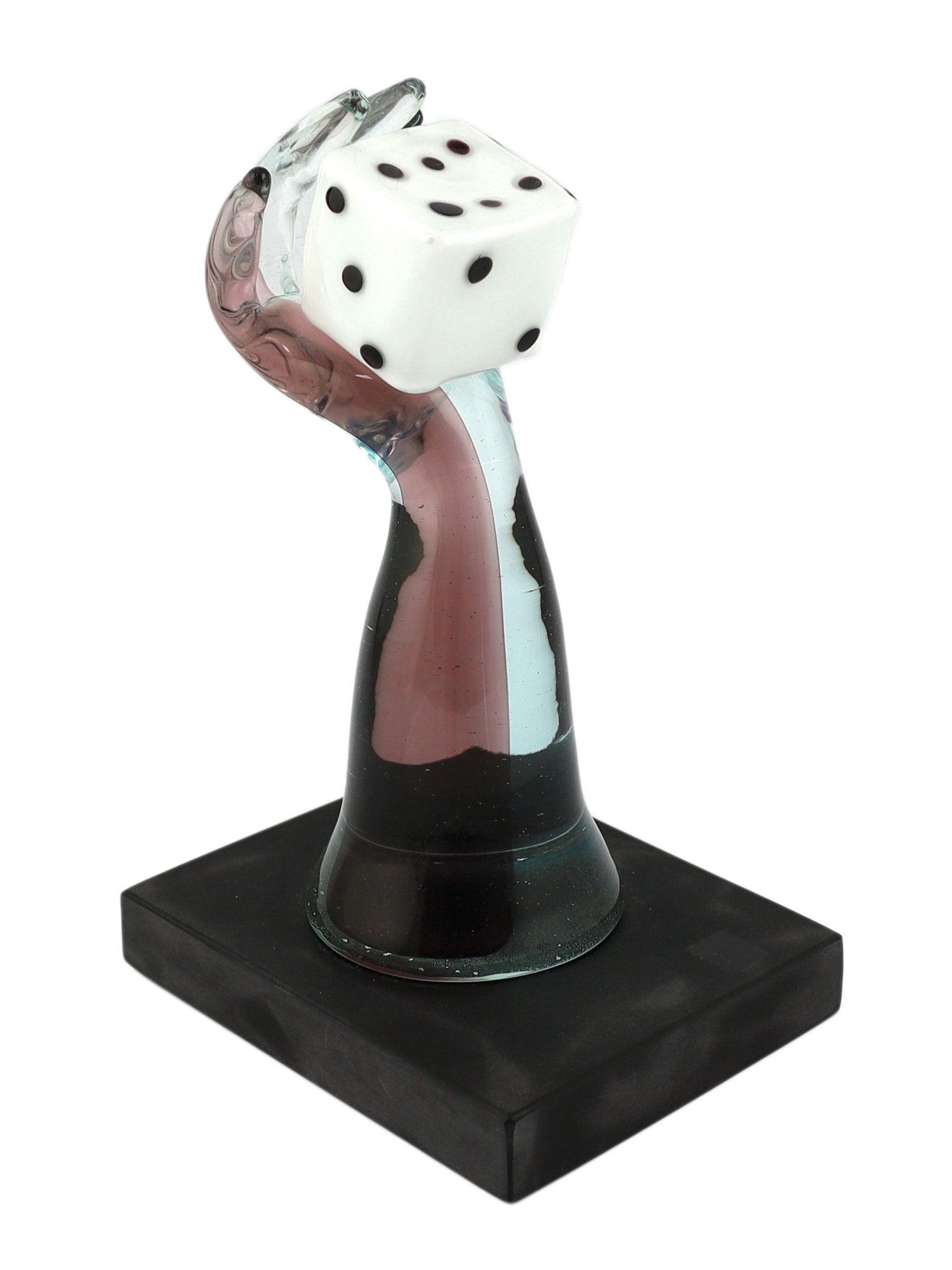 A Murano Vetreria amethyst glass arm, holding a white, black spotted, dice in hand